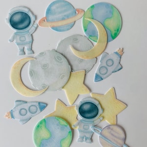 Essbare Cupcake / Muffin Aufleger / Tortendeko Weltall Astronaut Planeten 18 Stück AUSGESTANZT aus Esspapier oder Fondant