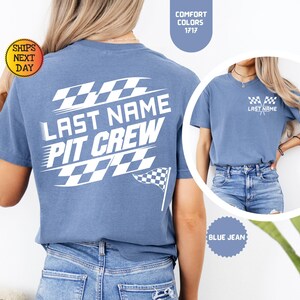 May include: A blue t-shirt with a white checkered flag design and the text "LAST NAME PIT CREW".
