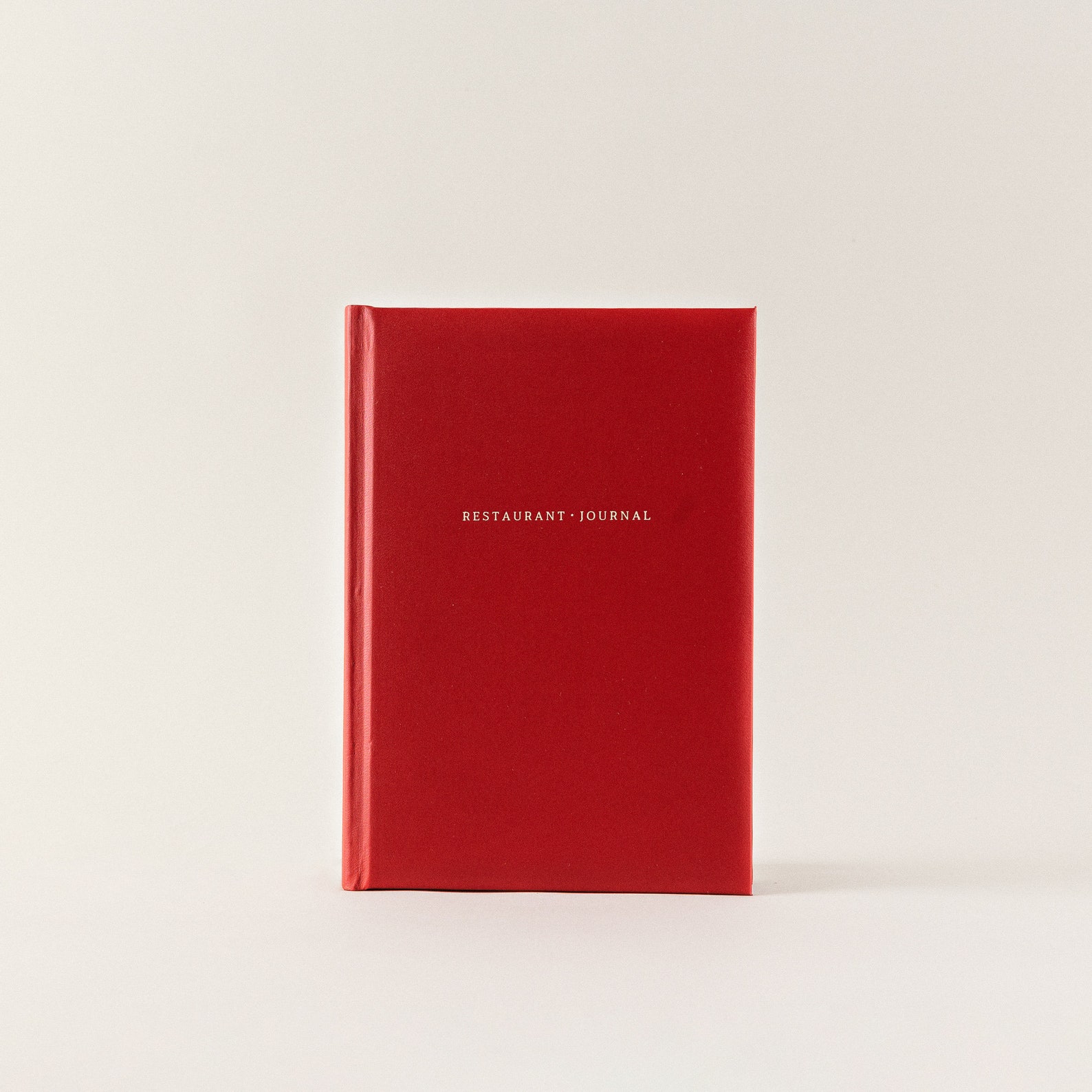 thoughtful gift ideas for him. red leather restaurant journal