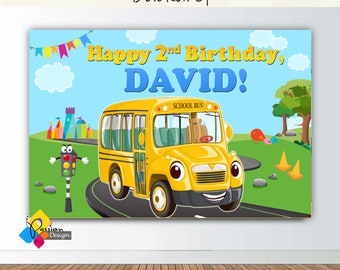 May include: A blue and yellow birthday backdrop with a cartoon school bus, a traffic light, and the text "Happy 2nd Birthday, DAVID!"