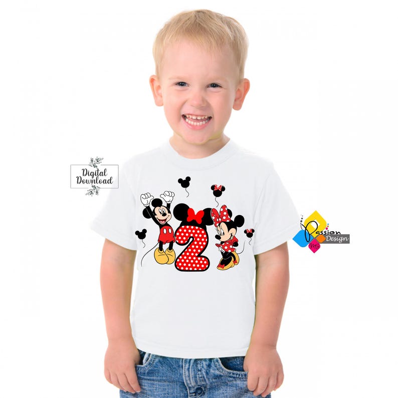 May include: White t-shirt with a red and black Mickey Mouse and Minnie Mouse design. The design features Mickey Mouse and Minnie Mouse holding red balloons with a red number 2 with white polka dots in the center.