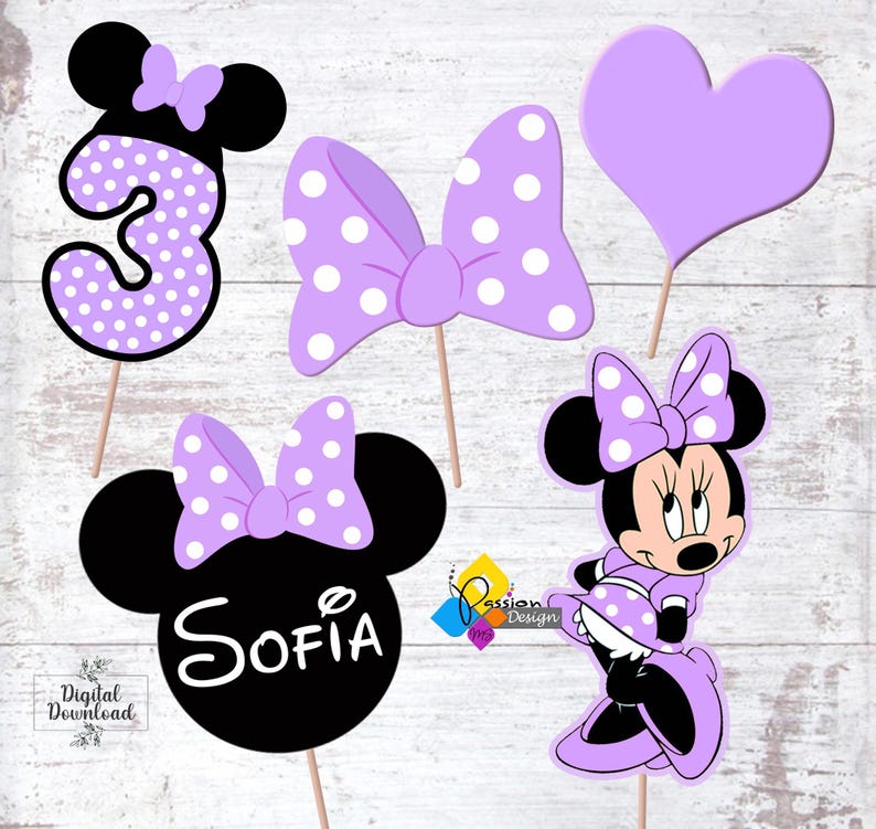 May include: Purple and black Minnie Mouse themed party decorations with a number 3, a bow, a heart, and a Minnie Mouse head with the name Sofia.