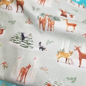 Clothworks Quilting Cotton Christmas Snow Skunk Deer Fox in Mint Fabric