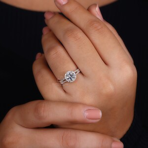Eco-conscious elegance with this Lab Created Diamond Halo Ring in a classic white gold setting