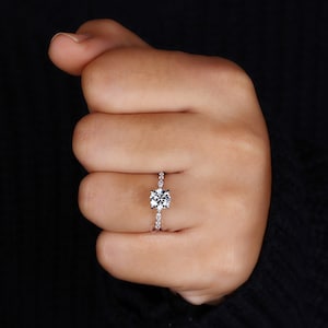 Hand displaying the brilliance of a CVD Diamond Ring, highlighting the exquisite pave band.