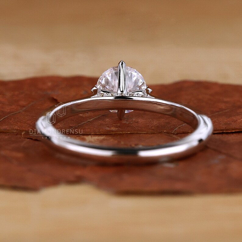 Lab Grown Diamond, ethically sourced and shining brightly on a velvet cushion.