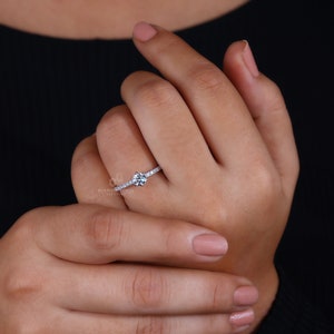 2 Carat Diamond Ring's Radiance on Finger - Close-up on Hand