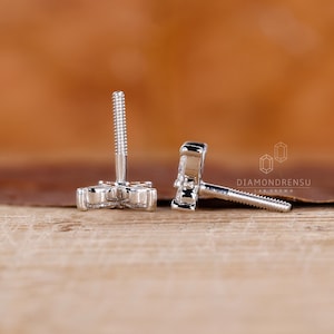 Butterfly stud earrings in a stunning white gold finish.