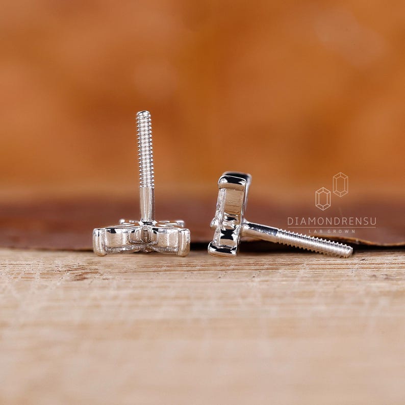 Butterfly stud earrings in a stunning white gold finish.