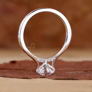 Unique Bridge Accent Ring design featuring shimmering side stones.