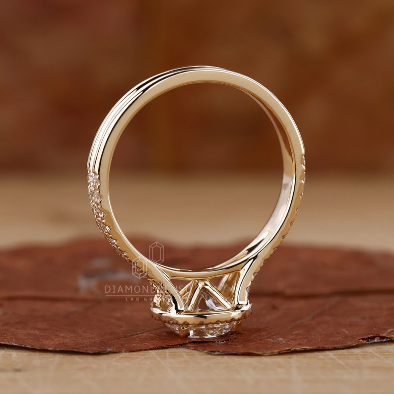 Round Diamond Halo Engagement Ring, a quintessential Wedding Gift, shimmering in yellow gold