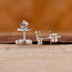 Marquise and round diamond earrings in a prong setting.