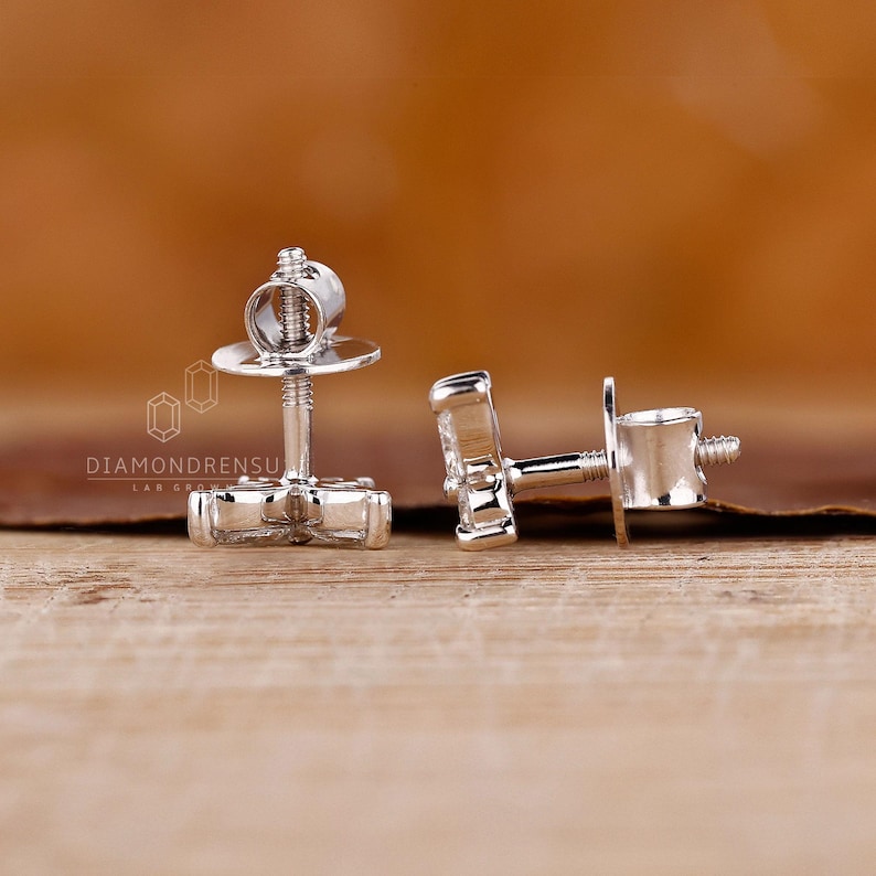 Marquise and round diamond earrings in a prong setting.