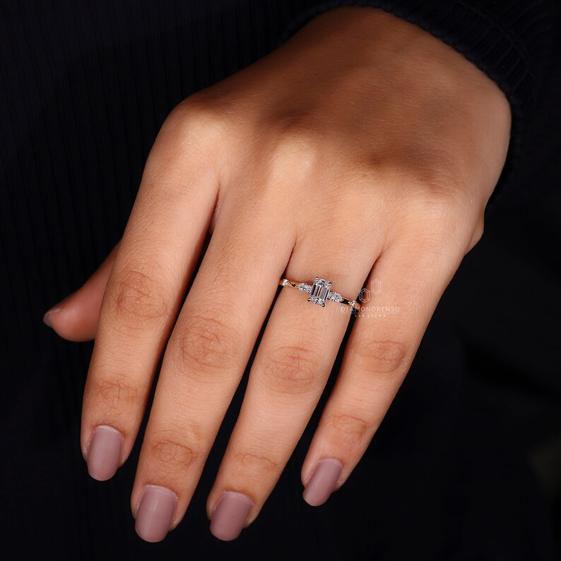 side marquise and round diamond ring