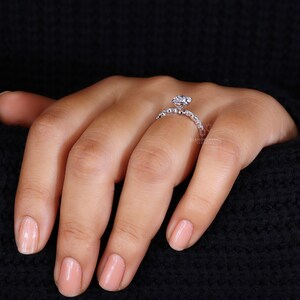 Finger adorned with a stunning CVD Diamond Ring, a testament to sustainable elegance.