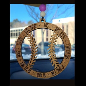 May include: Wooden baseball-shaped car charm with the words "STRIKE RING EM UP SEND ER NICE SNATCH BAD BOUNCE HOME RUN SAFE HOME PLATE TAST" engraved around the edge.