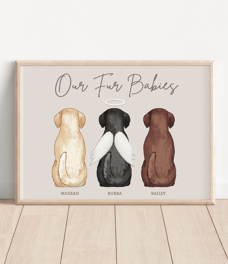 May include: A watercolour painting of three dogs, a yellow labrador, a black labrador with angel wings, and a brown labrador. The dogs are sitting in a row and the text "Our Fur Babies" is above them. The dogs are labelled "Meekah", "Bubba", and "Bailey".