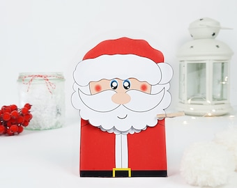 La Ilustración De La Mini Papá Noel Con El Sombrero De Navidad Que Aparece En La Linda Caja Grande De Regalos | Vector Premium