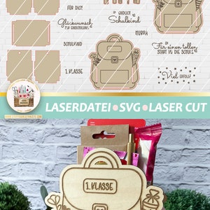May include: A wooden craft kit for a school-themed gift box. The kit includes a laser-cut design of a backpack with the text "1. Klasse" and "Sei frech und wild & wunderbar".