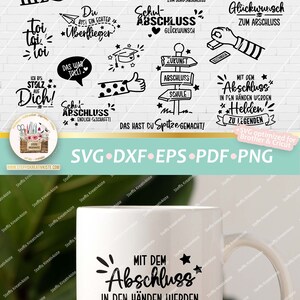 May include: A white mug with a black design that says "Mit dem Abschluss in den H&auml;nden werden Helden zu Legenden". The design is surrounded by stars and a banner.