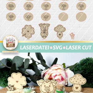 May include: A set of laser cut wood craft designs featuring a pig, a mushroom, a four-leaf clover, and a bottle with glitter. The designs are for a craft project and include the text "Eine Portion Gl&uuml;ck" which translates to "A Portion of Luck".