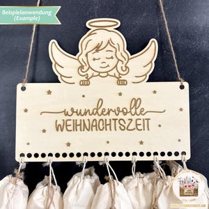 May include: A wooden Christmas advent calendar with a sign that reads "wundervolle WEIHNACHTSZEIT" and a small angel figure at the top. The calendar has 12 small fabric bags hanging from it.