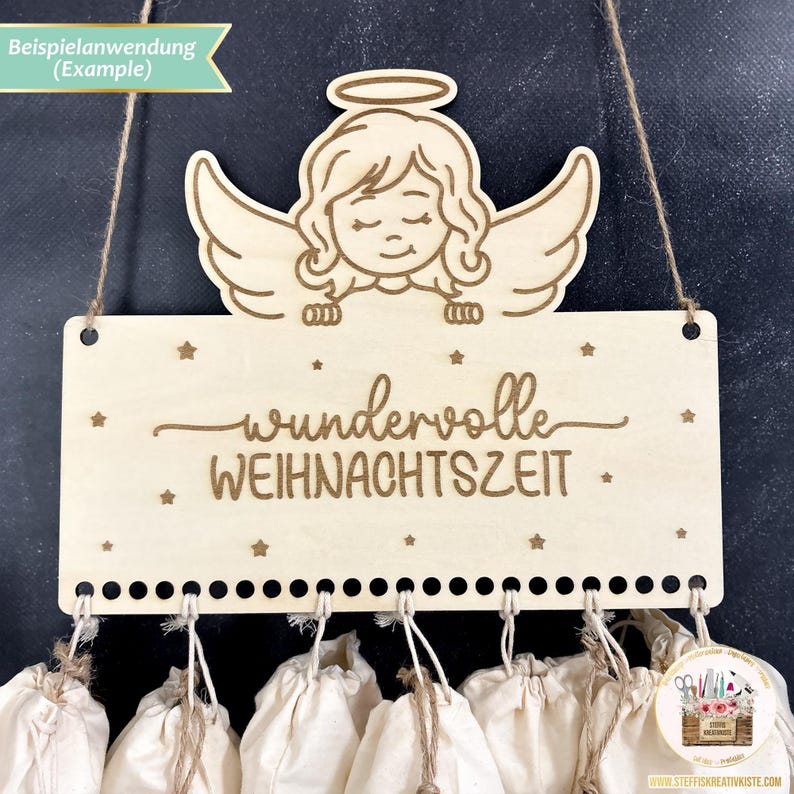 May include: A wooden Christmas advent calendar with a sign that reads "wundervolle WEIHNACHTSZEIT" and a small angel figure at the top. The calendar has 12 small fabric bags hanging from it.