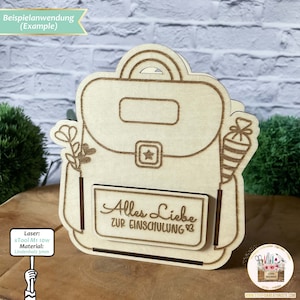 May include: A wooden cutout of a backpack with the text "Alles Liebe zur Einschulung" (German for "All the best for starting school") on the front. The backpack is decorated with a flower and a party favour.