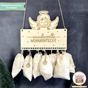 May include: A wooden advent calendar with a cutout angel design and the text "wundervolle WEIHNACHTSZEIT". The calendar has 24 small fabric pouches hanging from it.