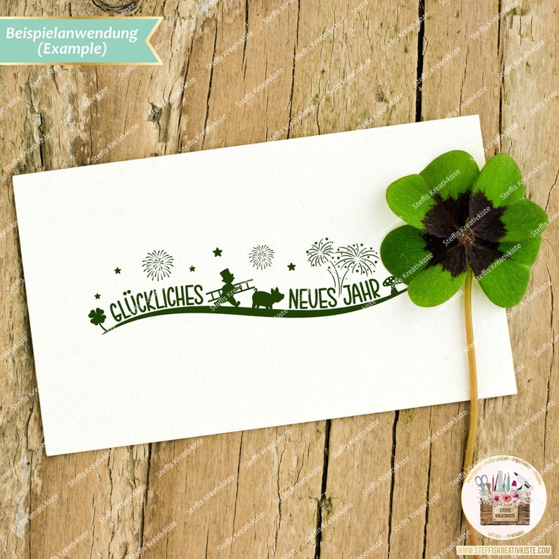 May include: A green stamp with a chimney sweep, a pig, fireworks, and the text "Gl&uuml;ckliches Neues Jahr" which translates to "Happy New Year".