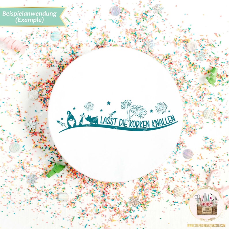May include: A white round sticker with a teal design of gnomes, fireworks, and the text "LASST DIE KORKEN KNALLEN" on a white background with colorful confetti.