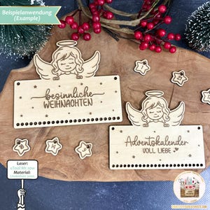 May include: A wooden Advent calendar with two sections. The top section features an angel with the text "besinnliche WEIHNACHTEN". The bottom section features an angel with the text "Adventskalender VOLL LIEBE". Both sections have a row of holes for hanging ornaments.