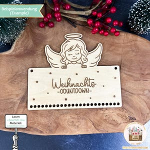 May include: A wooden Christmas countdown plaque with a small angel figure at the top. The plaque has the text "Weihnachts -COUNTDOWN- " and 24 small circles for counting down the days until Christmas.