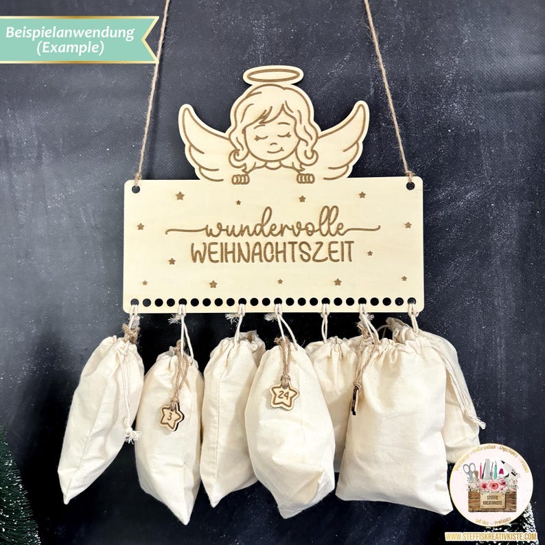 May include: A wooden Christmas advent calendar with a hanging angel and the text "wundervolle WEIHNACHTSZEIT". The calendar has 24 small fabric bags hanging from it.