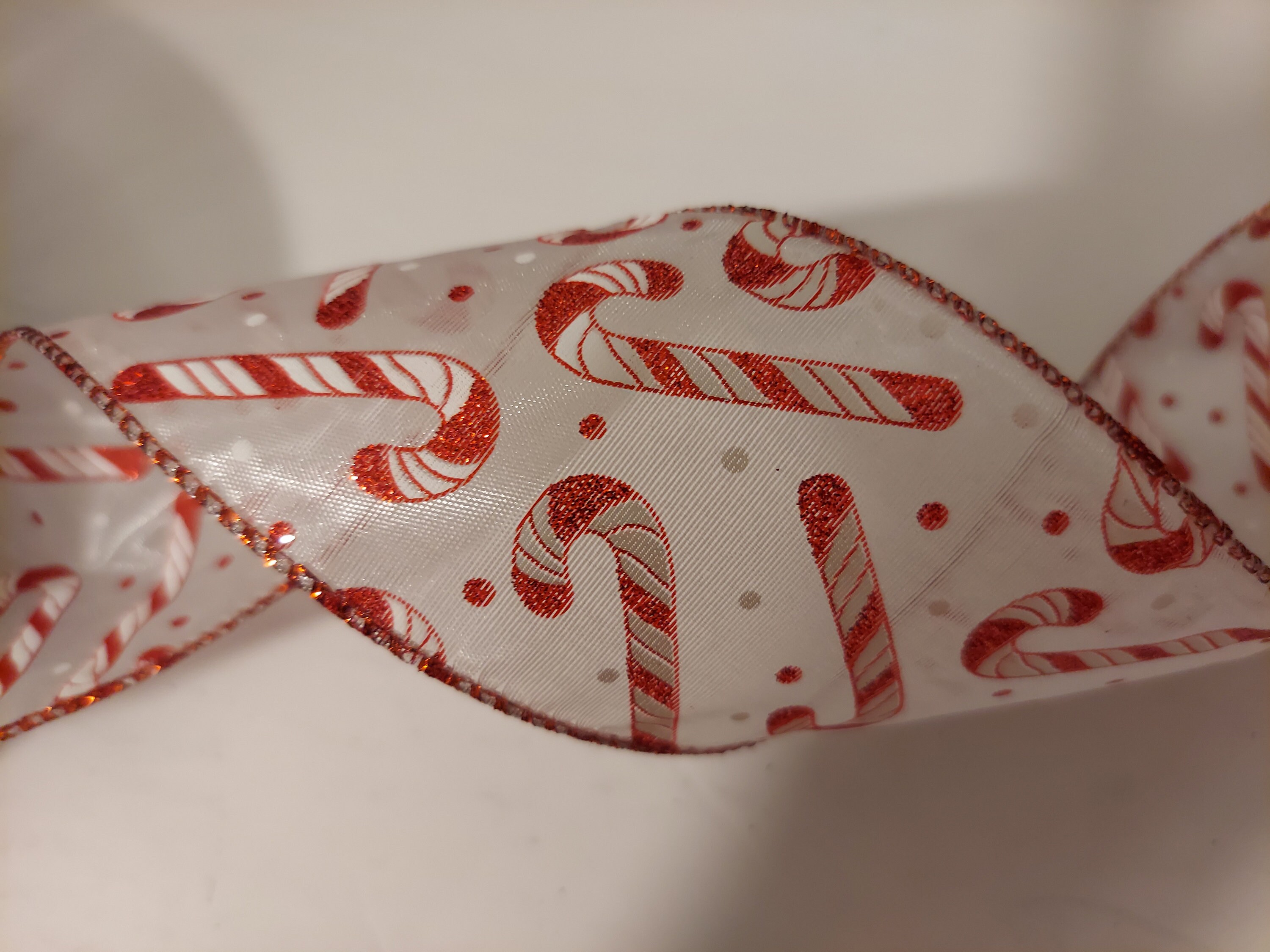 5 yds Wired Ribbon, Glitter Candy Cane pattern on a white background, with a red edge