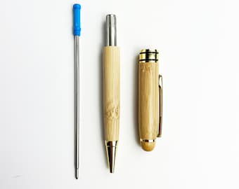 May include: Two bamboo pens with gold accents. One pen has a blue retractable tip and the other has a gold cap.