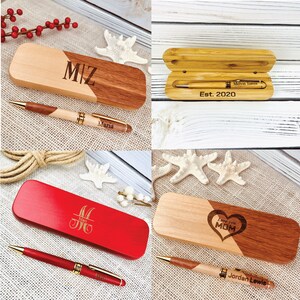 May include: Four different wooden pen and box sets. The first set has a light brown and dark brown box with the initials "M/Z" engraved on the top. The second set has a light brown box with the text "Melvin Torres Est. 2020" engraved on the top. The third set has a red box with the initials "M&M" engraved on the top. The fourth set has a light brown and dark brown box with the text "Love your MOM" and a heart engraved on the top.