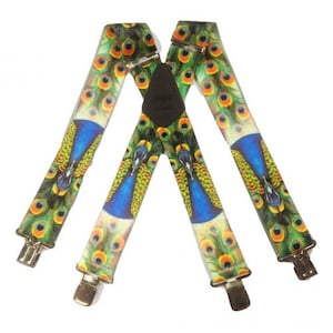 May include: A pair of suspenders with a peacock feather pattern. The suspenders are white with blue, green, and yellow peacock feathers. The suspenders have metal clips on each end.