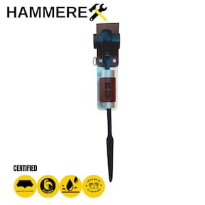 May include: A black and silver hammer with a brown leather sheath. The sheath has the text "SC-320" printed on it. The hammer is hanging on a white background. The image also includes a yellow and black logo with the text "HAMMERE" and a wrench and hammer symbol.