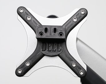 May include: A black metal monitor arm with a silver base. The arm is attached to a black monitor mount with the word "DELL" printed on it.