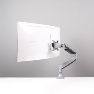 May include: A white curved computer monitor, branded Samsung, is mounted on a grey adjustable arm. The arm is attached to a base, allowing for flexible positioning. The setup is against a light grey background.
