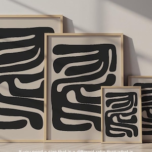 Beige and black abstract mid-century modern wall art featuring organic geometric shapes. This printable artwork blends minimalist aesthetics with neutral tones, perfect for contemporary living rooms, bedrooms, and offices. Available as a high-resolution digital download for instant printing