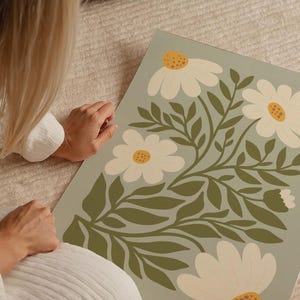 Sage green daisies printable wall art featuring soft floral elements in a muted green palette. This digital artwork blends modern botanical aesthetics with minimalist decor, perfect for living rooms, bedrooms, and stylish apartments. Available as a high-resolution digital download for instant printing