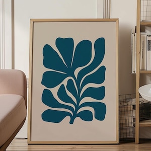 May include: A framed rectangular wall art print featuring a dark teal organic botanical shape centered on a solid light beige background. The frame is made of light-toned wood. The text FIRUM STUDIO with a small flower icon is printed at the bottom.