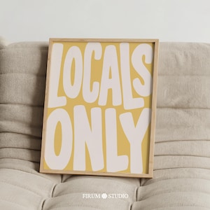 May include: A rectangular framed wall art print featuring a mustard yellow background with the text LOCALS ONLY written in large, bold, off-white sans-serif letters. The frame is made of light-colored wood with a thin, clean profile.
