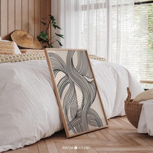 This Black Abstract Wave Art Print features bold, flowing lines that create an elegant and dynamic visual impact. The minimalist design, with its black and white color palette, perfectly fits modern and mid-century decor. Ideal for contemporary living rooms, bedrooms, or offices, this art piece brings sophistication and balance to any space. Instantly downloadable, it’s a stylish addition to any home, offering both modern charm and timeless appeal for those who appreciate minimalist aesthetics.