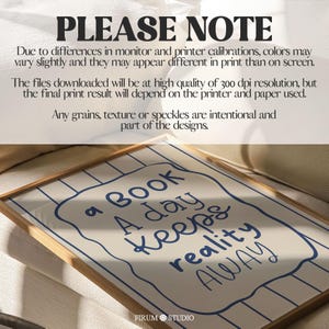 Whimsical hand-drawn wall art featuring the quote “A Book A Day Keeps Reality Away” in playful navy-blue lettering on a cream background with vertical wavy stripes and a doodled frame. This charming printable is perfect for book lovers, cozy reading nooks, or eclectic dorm decor. A delightful mix of humour and escapism, ideal for adding personality to your digital download art collection or gifting to fellow bibliophiles.