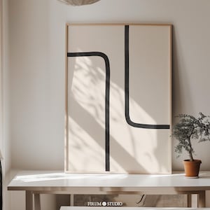 Peut inclure: Une impression d'art murale rectangulaire dans un cadre en bois clair présentant un fond beige avec deux lignes noires épaisses. Une ligne courbe du haut à gauche vers le bas au centre, tandis que l'autre ligne verticale s'étend du haut vers la droite.