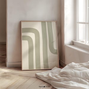 Minimalist sage green abstract stripes wall art with Japandi-inspired design. This printable artwork features organic, modern lines in a neutral color palette, perfect for contemporary living rooms, bedrooms, and offices. Available as a high-resolution digital download for instant printing
