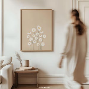 Soft cream daisy floral wall art featuring a minimalist beige botanical illustration. This printable artwork blends modern boho aesthetics with a neutral color palette, perfect for contemporary living rooms, bedrooms, and gallery walls. Available as a high-resolution digital download for instant printing.